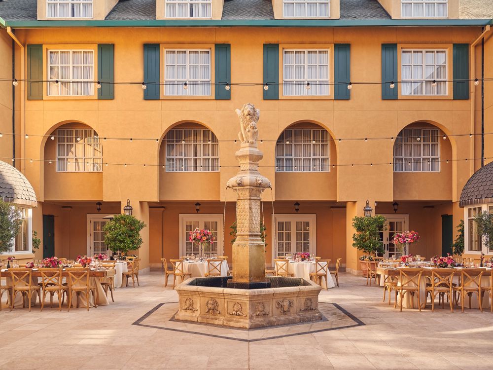 Courtyard With Fountain And Tables