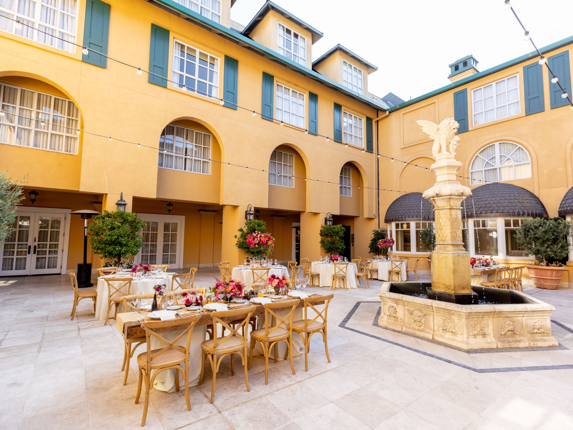 Courtyard With Tables And Fountain